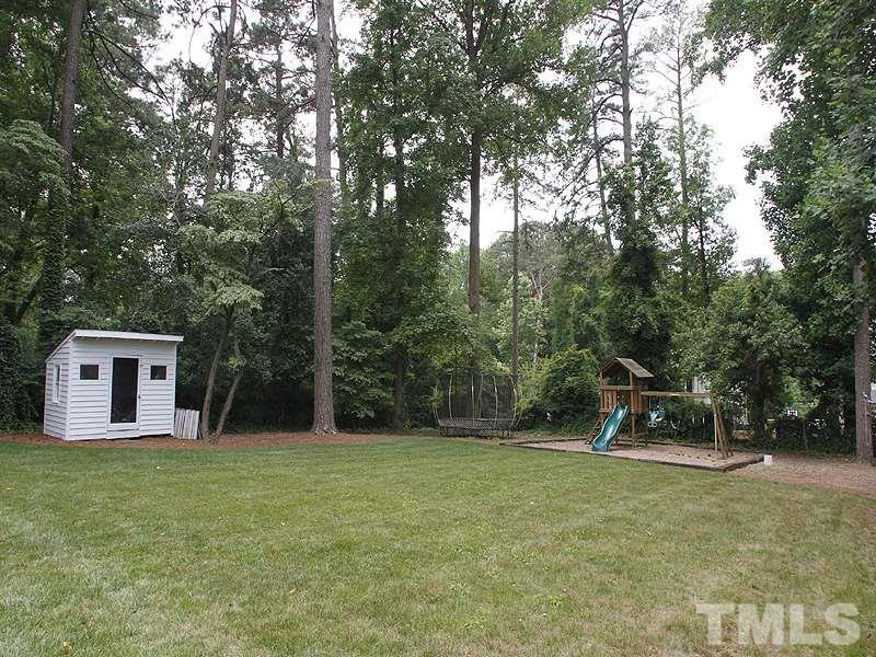 1307 Duplin Road Raleigh, NC 27607 - Photo 17 of 19 a backyard of a house with table and chairs