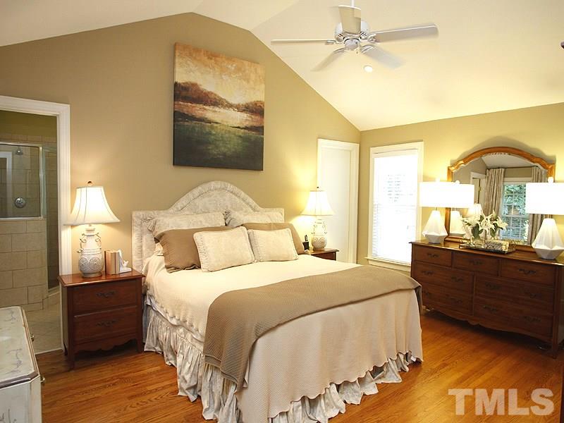 1307 Duplin Road Raleigh, NC 27607 - Photo 5 of 19 a bedroom with a bed and wooden floor