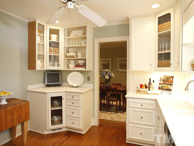 1307 Duplin Road Raleigh, NC 27607 - Photo 8 of 19 a kitchen with a cabinets and wooden floor