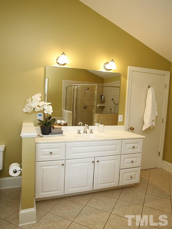 1307 Duplin Road Raleigh, NC 27607 - Photo 9 of 19 a bathroom with a double vanity sink and a mirror