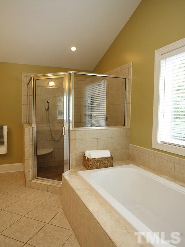 1307 Duplin Road Raleigh, NC 27607 - Photo 10 of 19 a bathroom with a bathtub and a shower