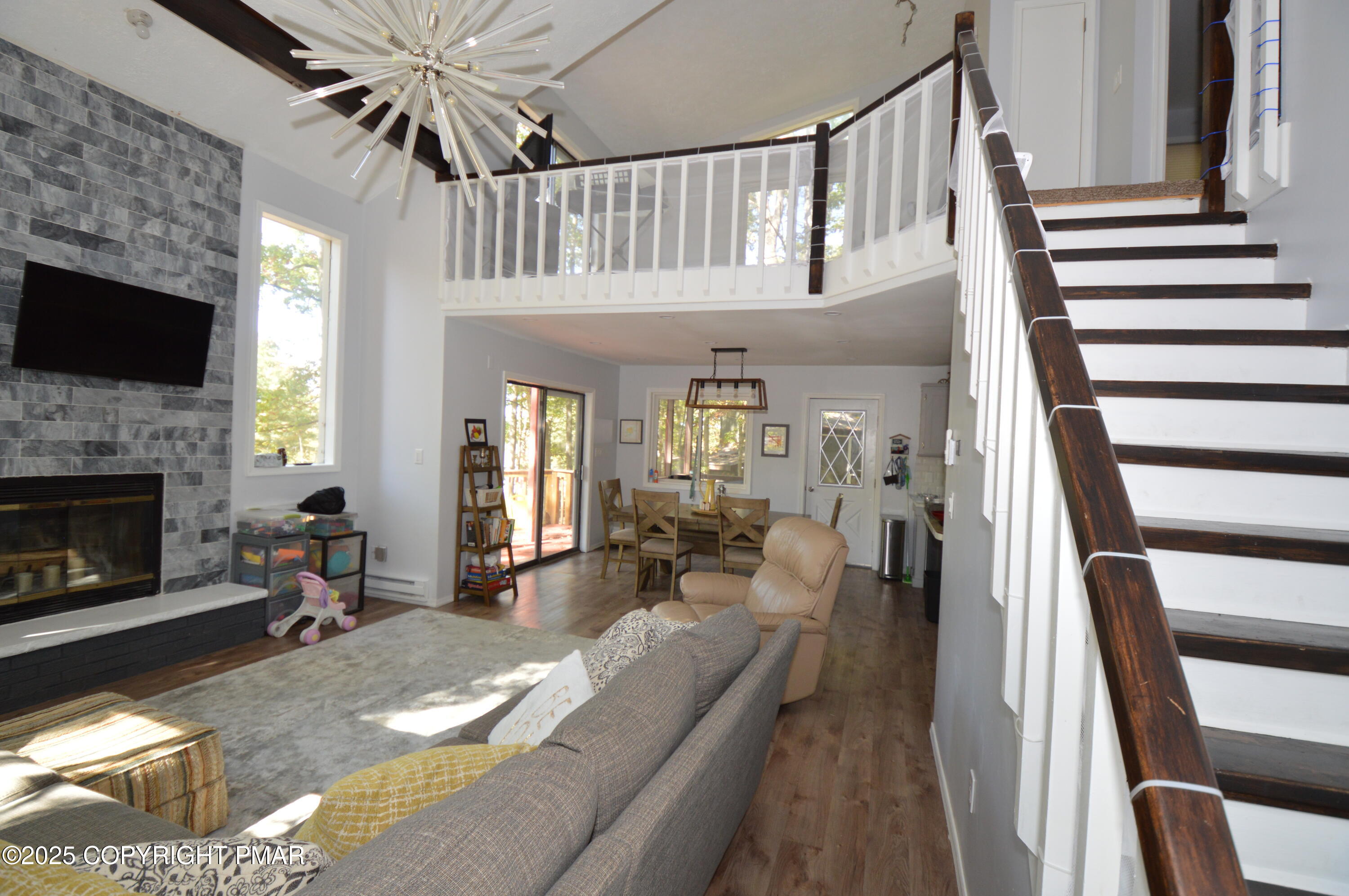 128 Ashley Court Bushkill, PA 18324 - Photo 22 of 43 a living room with furniture and a fireplace
