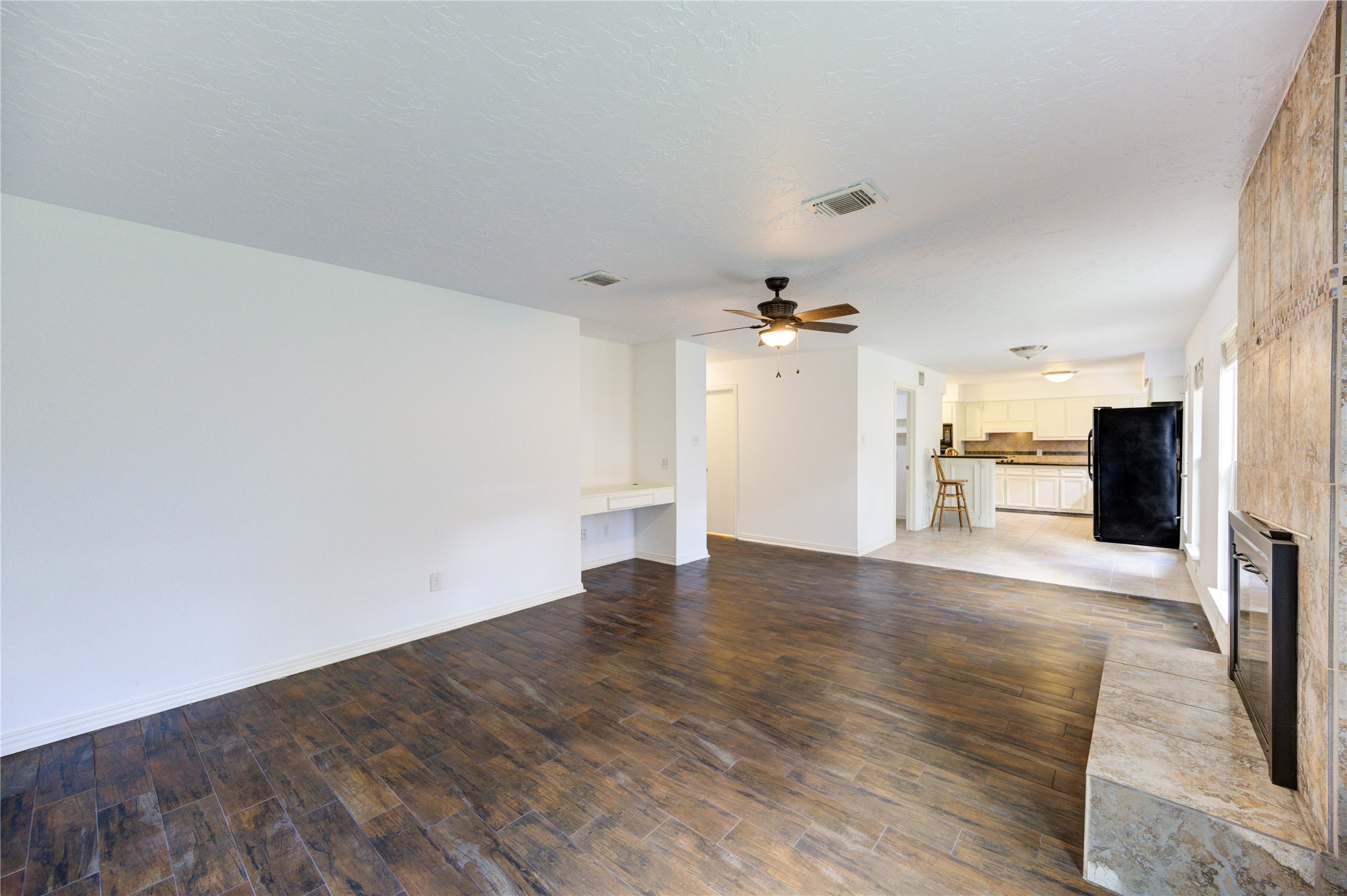 3639 Fir Forest Drive Spring, TX 77388 - Photo 13 of 44 a view of a kitchen with a sink and a refrigerator