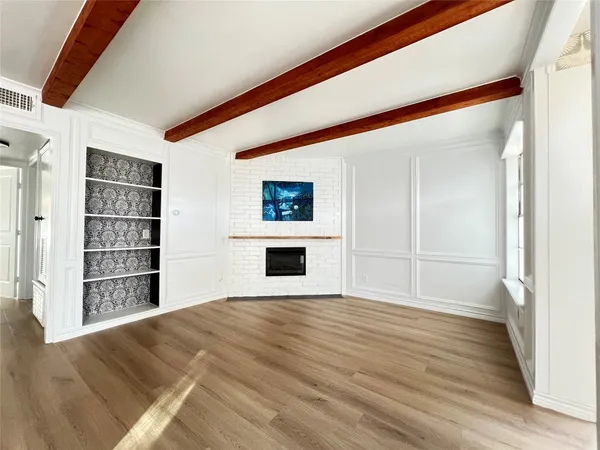 a view of a livingroom with wooden floor