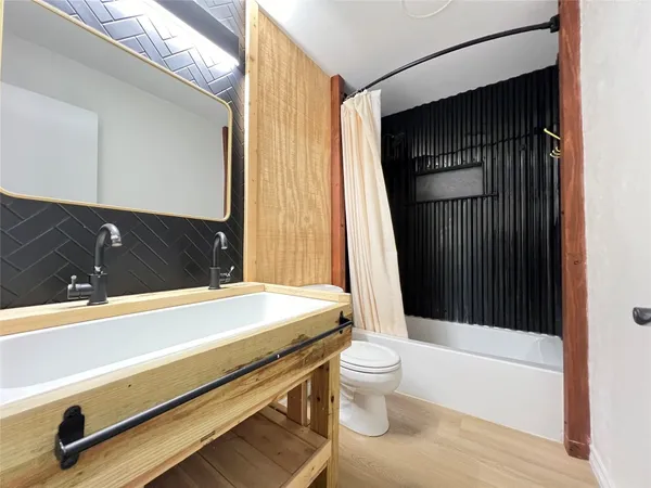a bathroom with a sink and a bathtub