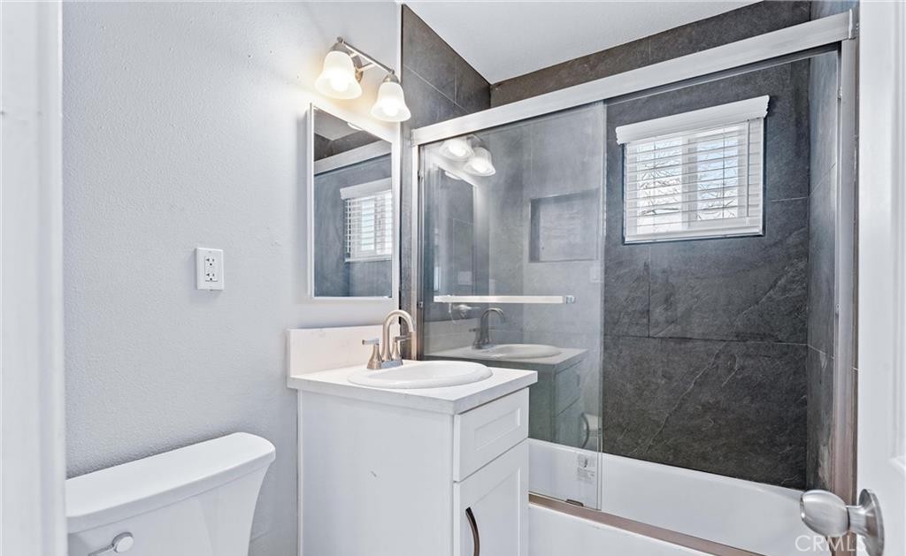 1531 West Orange Grove Avenue Pomona, CA 91768 - Photo 11 of 16 a bathroom with a sink toilet and shower