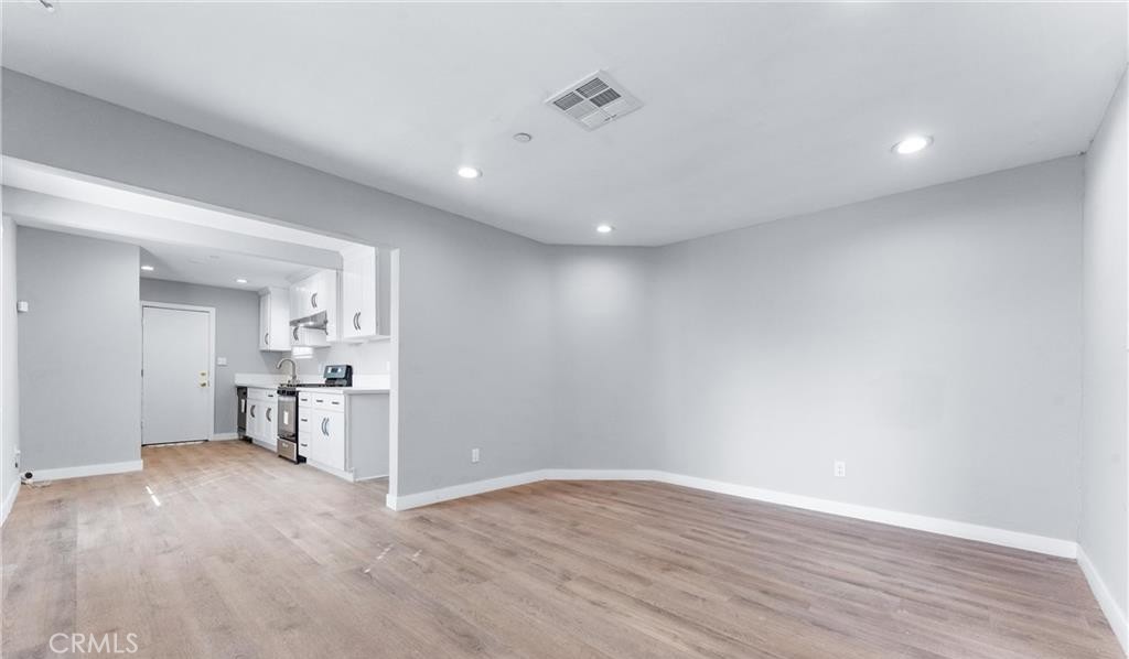 1531 West Orange Grove Avenue Pomona, CA 91768 - Photo 14 of 16 a view of empty room with wooden floor