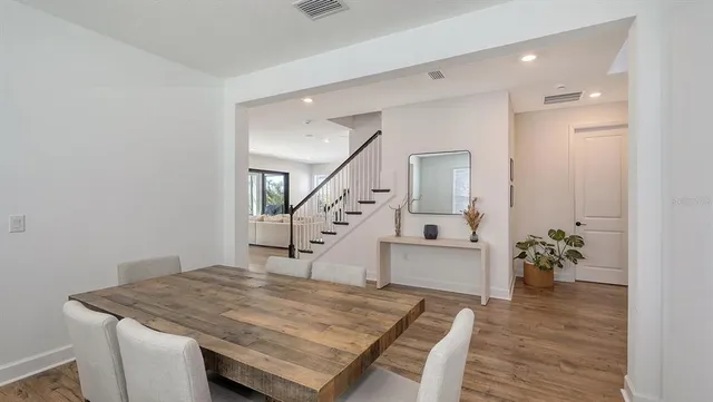 a large kitchen with lots of counter space and stainless steel appliances