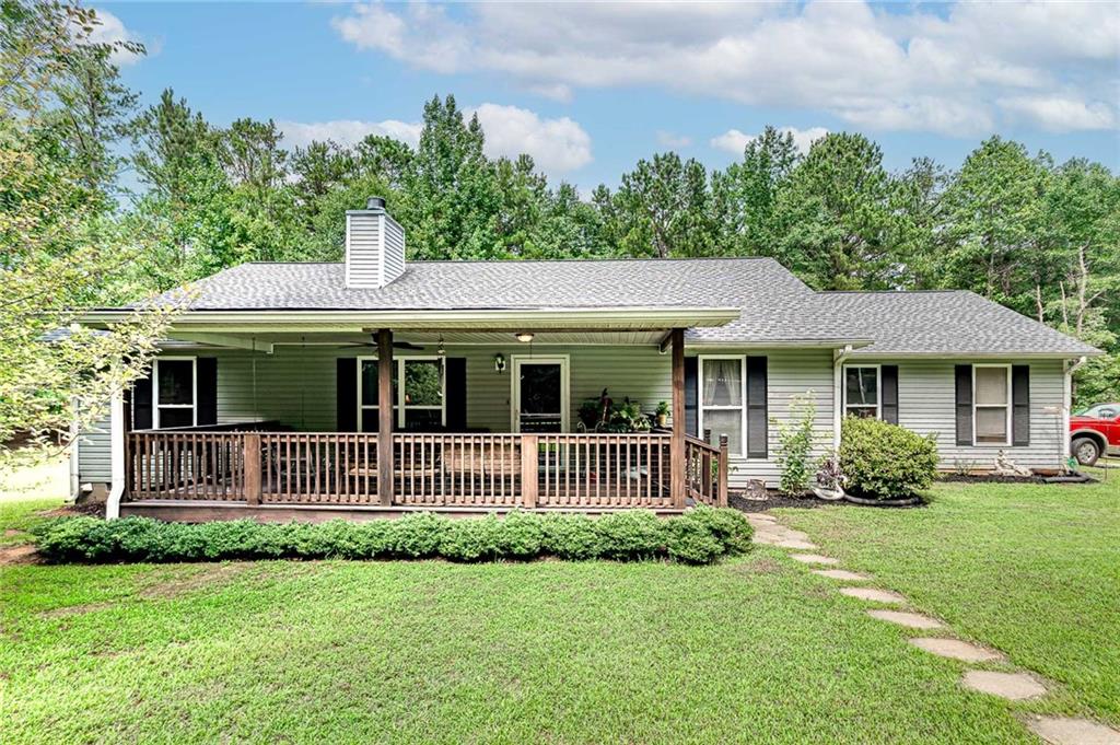 197 Conley Ditch Road Covington, GA 30014 - Photo 1 of 1 a front view of a house with a garden