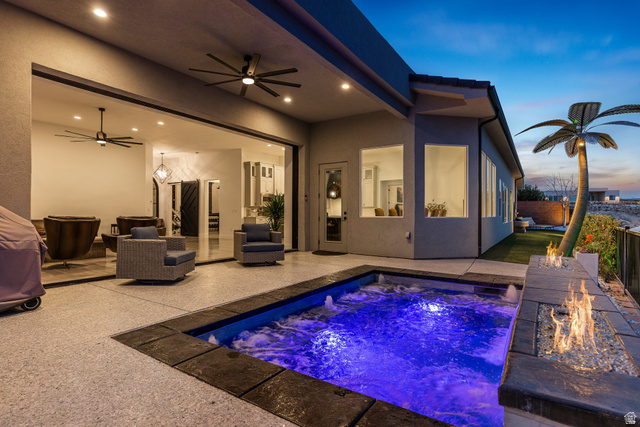 3022 West Sesia Way St. George, UT 84770 - Photo 3 of 52 Swimming pool featuring a fire pit and a patio area