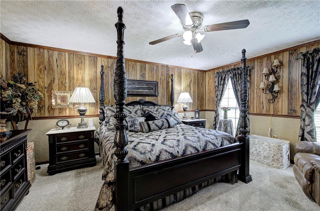 3637 Nebo Road Hiram, GA 30141 - Photo 30 of 63 a bedroom with a bed a large window and flat screen tv