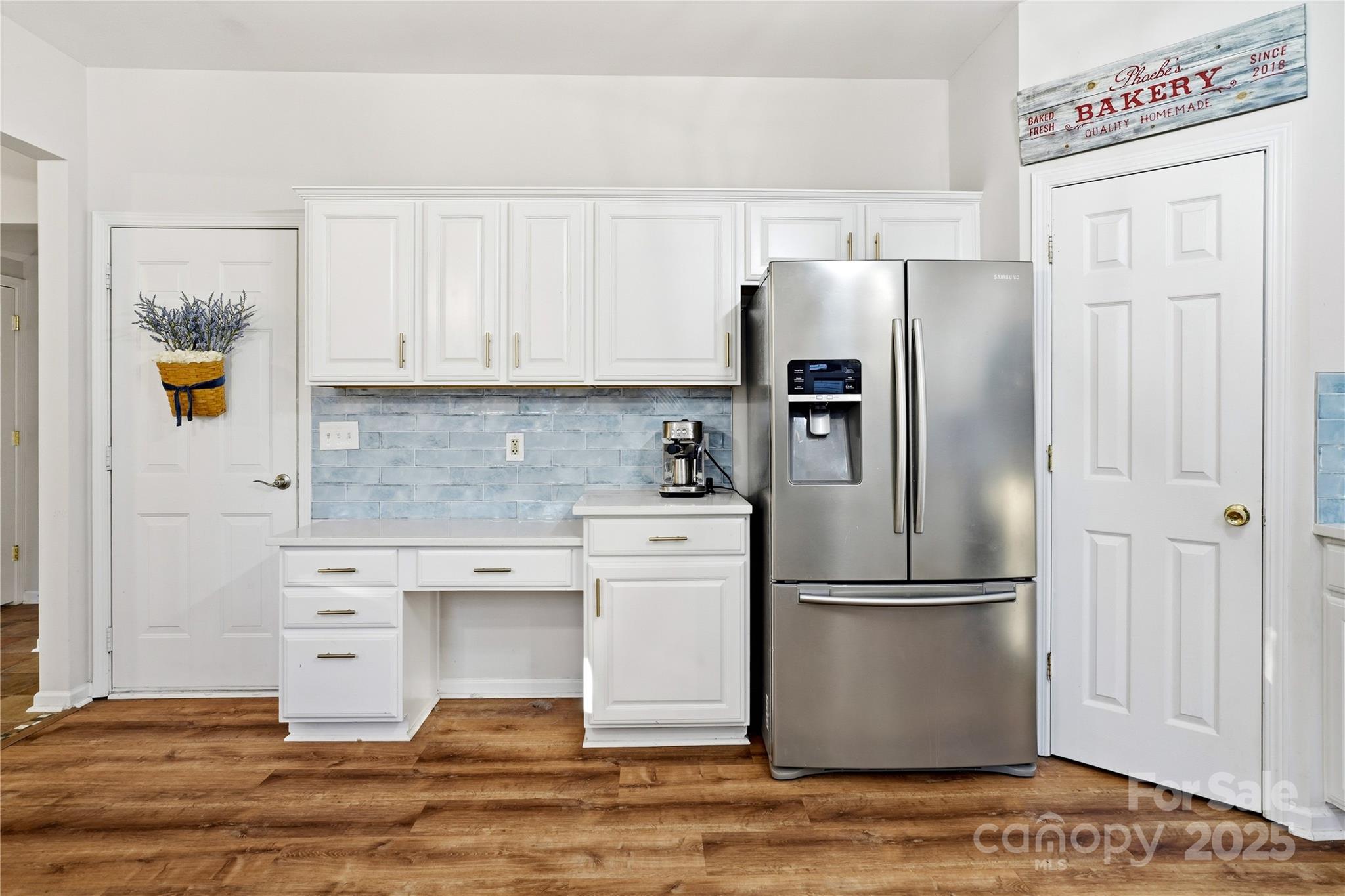 18015 Harbor Mist Road Cornelius, NC 28031 - Photo 14 of 37 a kitchen with stainless steel appliances granite countertop a refrigerator and a stove