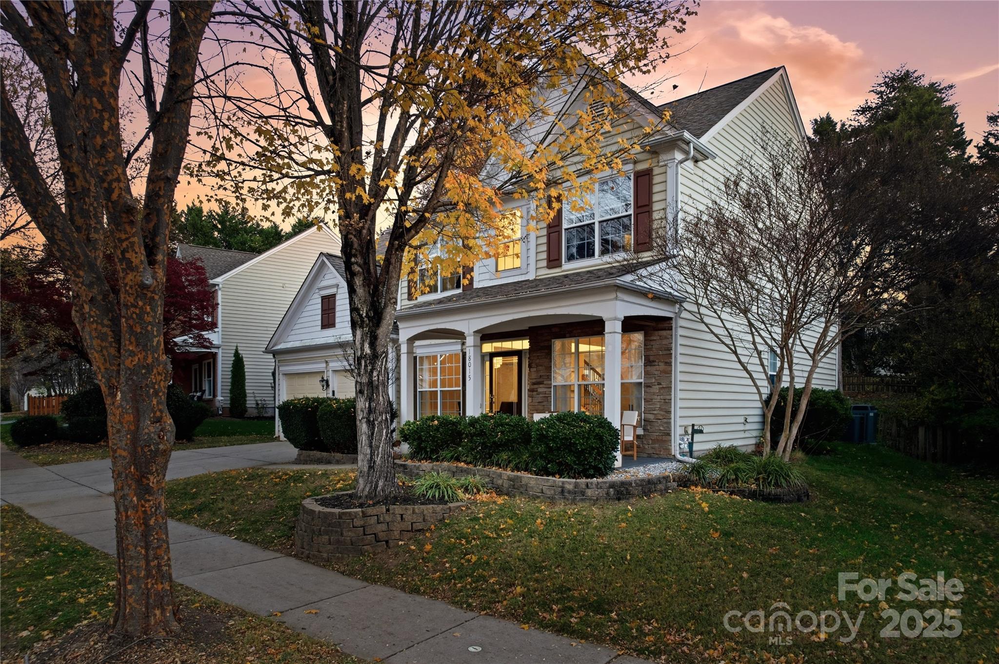 18015 Harbor Mist Road Cornelius, NC 28031 - Photo 2 of 37 a front view of a house with garden