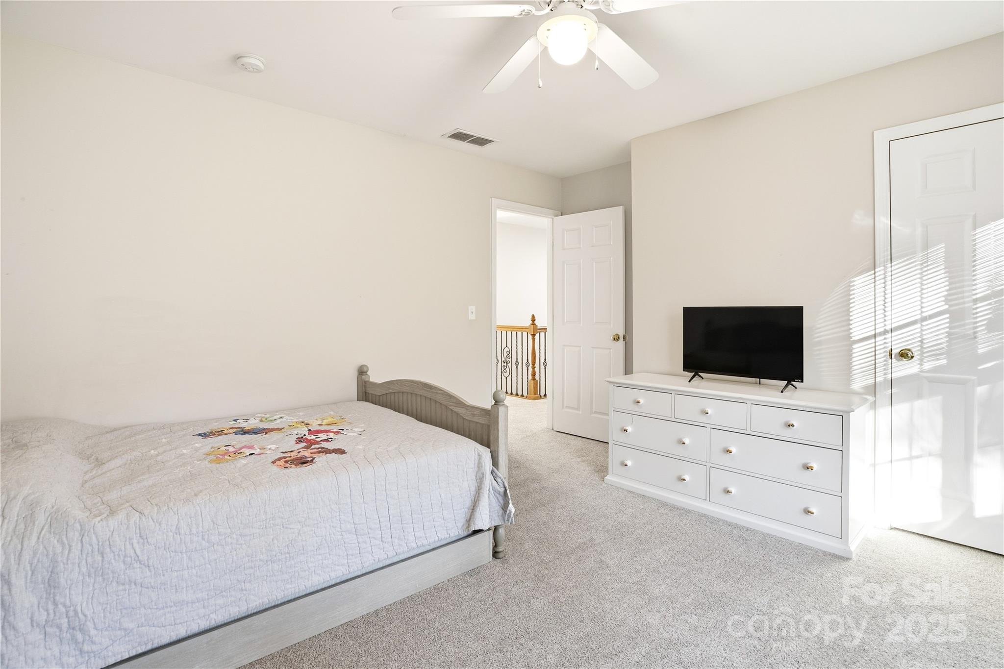 18015 Harbor Mist Road Cornelius, NC 28031 - Photo 27 of 37 a bedroom with a bed and a flat screen tv