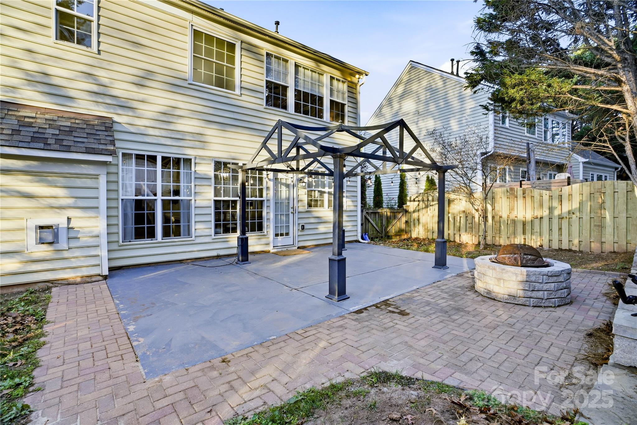 18015 Harbor Mist Road Cornelius, NC 28031 - Photo 31 of 37 a view of a house with a patio and a yard