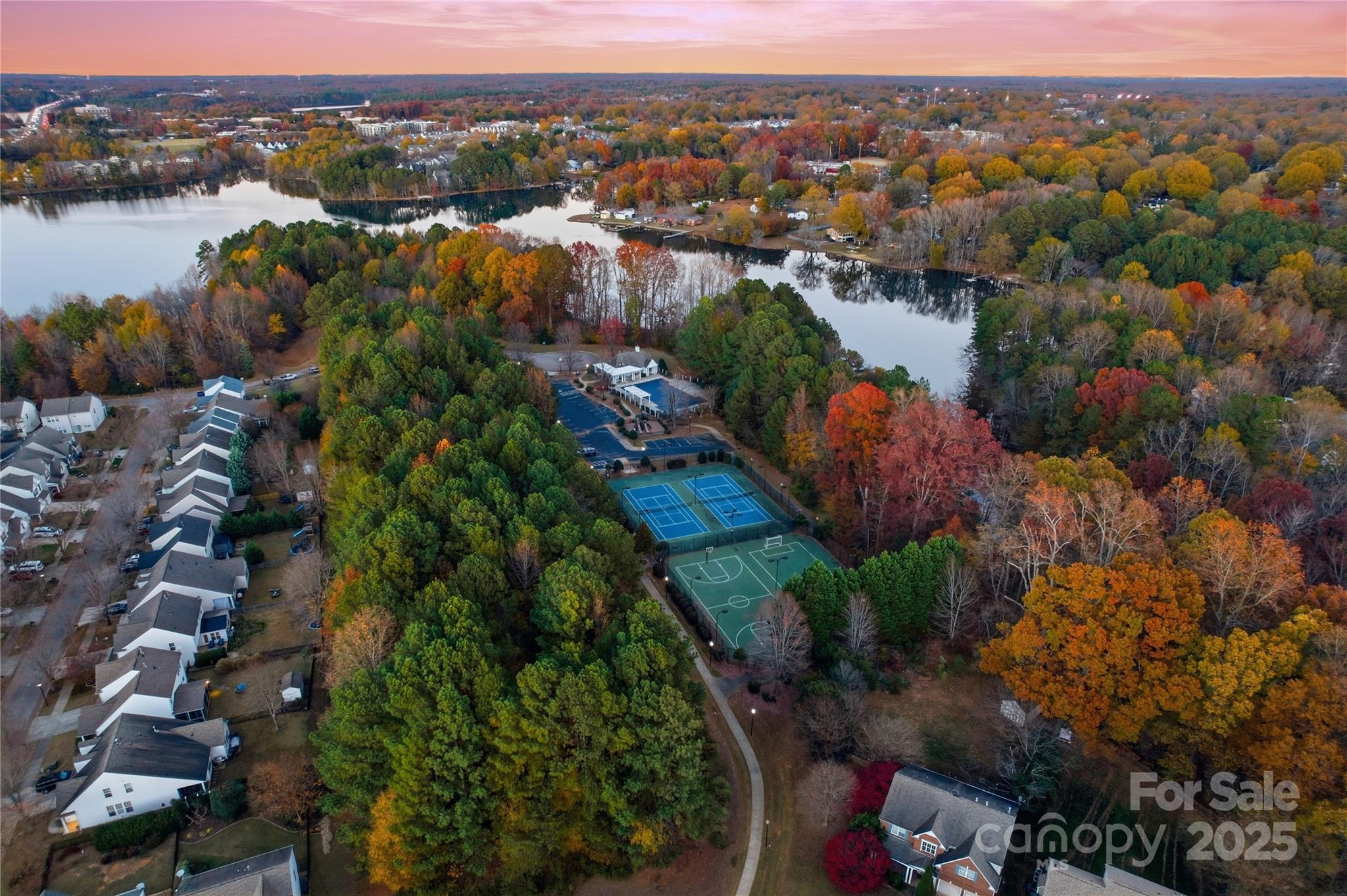 18015 Harbor Mist Road Cornelius, NC 28031 - Photo 36 of 37 an aerial view of lake residential house with swimming pool and mountain view