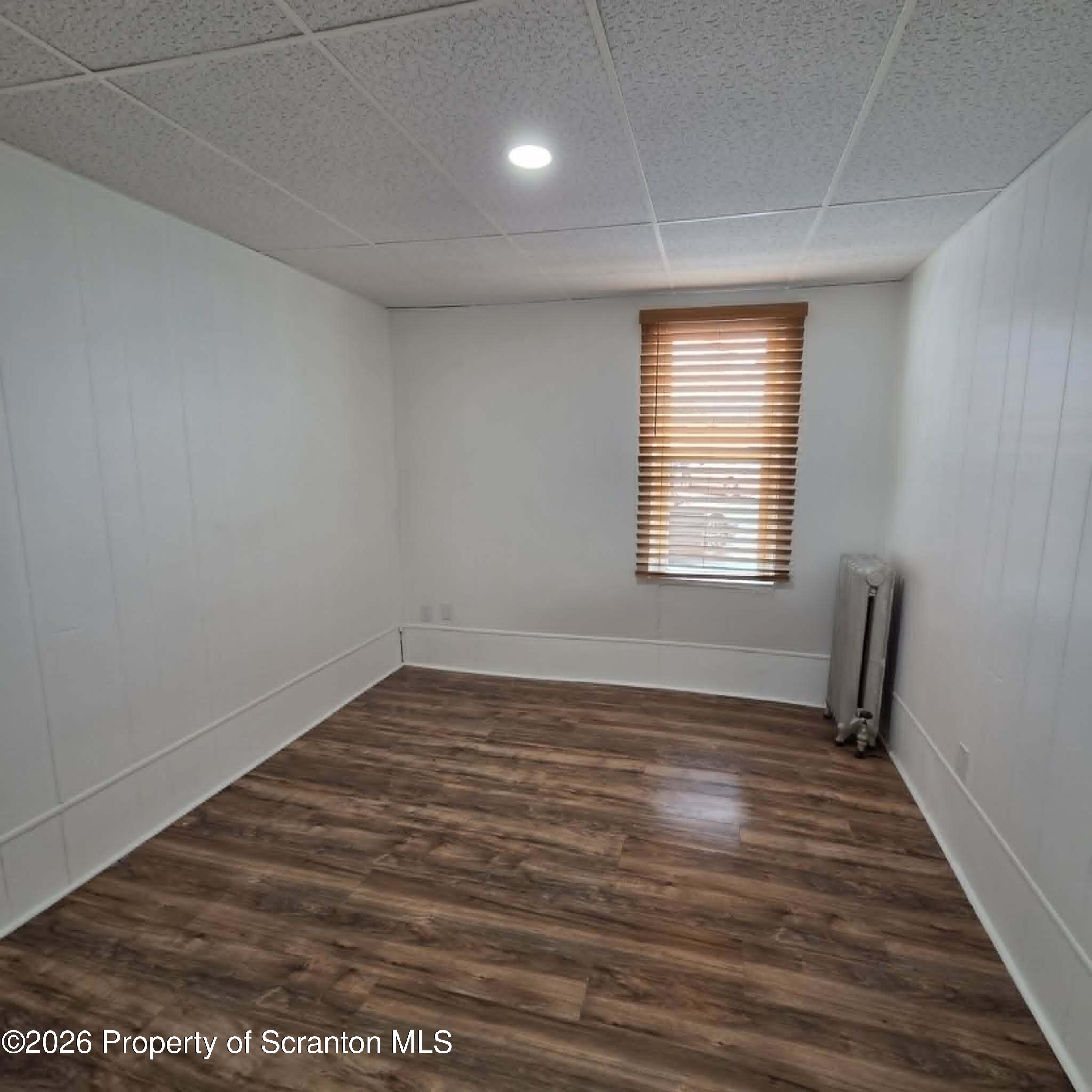 1606 Dickson Avenue, Unit 1 Scranton, PA 18509 - Photo 11 of 16 a view of a room with wooden floor and fan