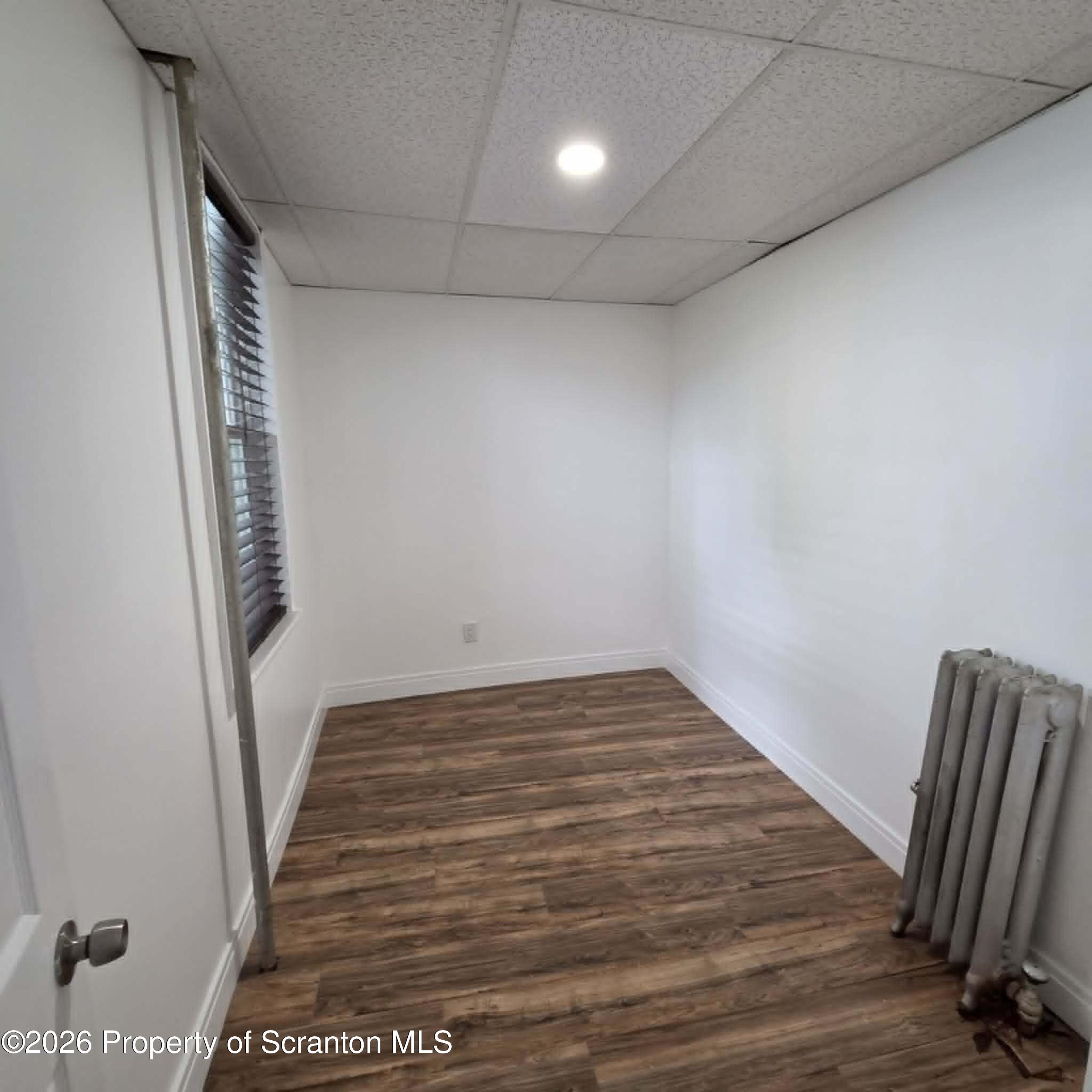 1606 Dickson Avenue, Unit 1 Scranton, PA 18509 - Photo 12 of 16 a view of a room with wooden floor and staircase