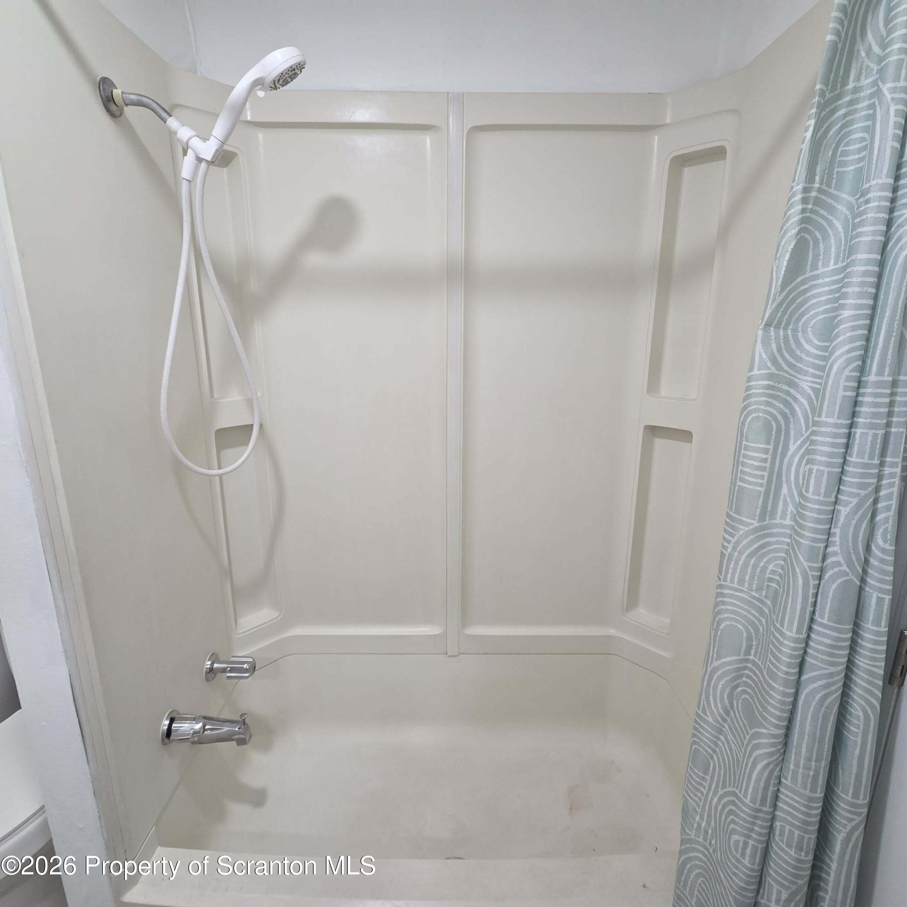 1606 Dickson Avenue, Unit 1 Scranton, PA 18509 - Photo 15 of 16 a bathroom with a glass shower door