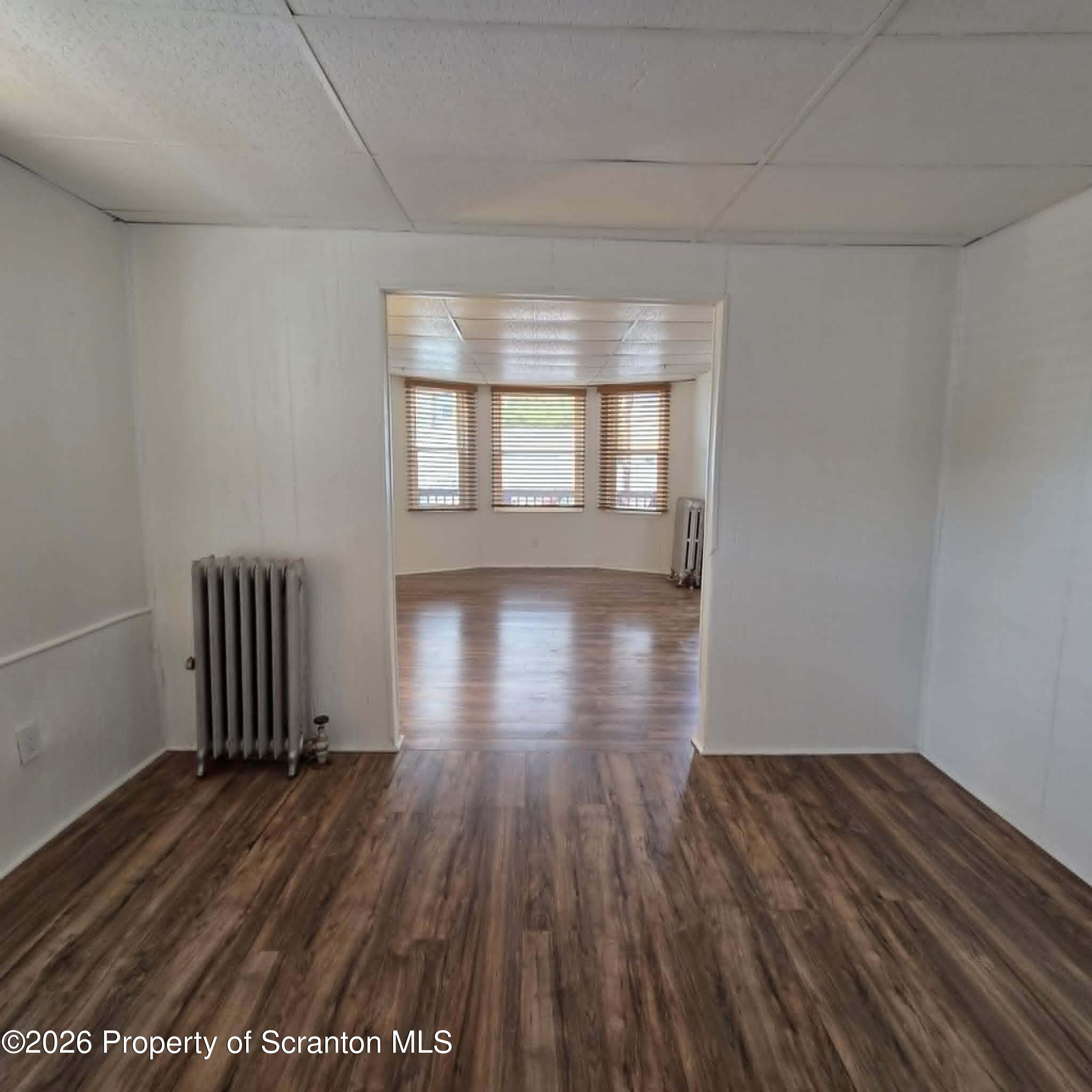 1606 Dickson Avenue, Unit 1 Scranton, PA 18509 - Photo 3 of 16 a view of empty room with wooden floor
