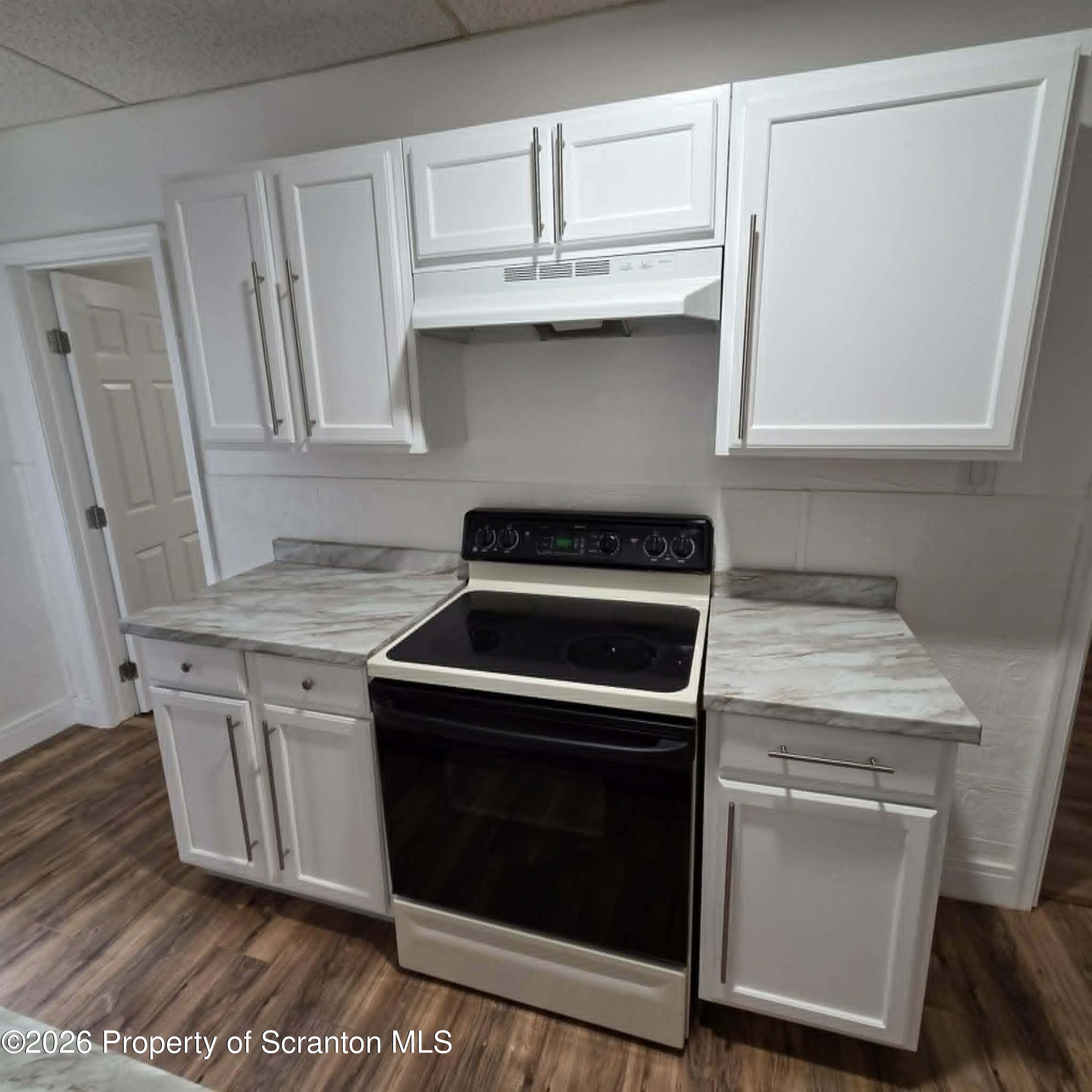 1606 Dickson Avenue, Unit 1 Scranton, PA 18509 - Photo 7 of 16 a stove top oven sitting inside of a kitchen