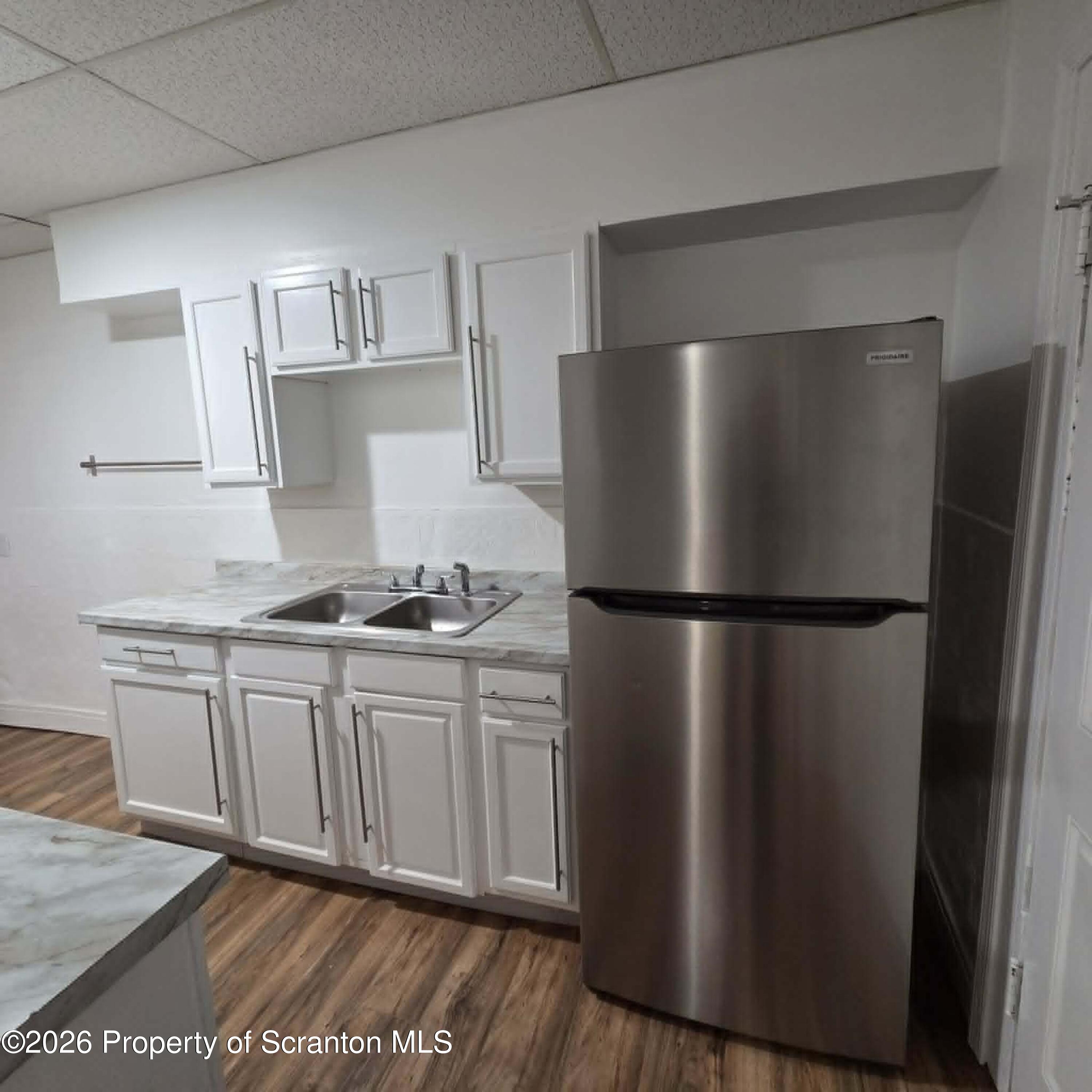 1606 Dickson Avenue, Unit 1 Scranton, PA 18509 - Photo 8 of 16 a kitchen with stainless steel appliances a refrigerator and a sink