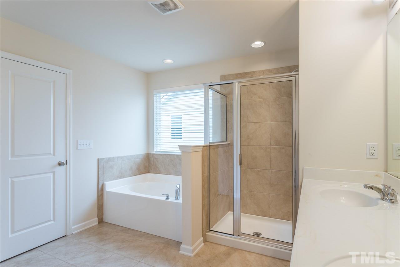 333 Hope Valley Road Knightdale, NC 27545 - Photo 12 of 22 a bathroom with a bathtub and shower