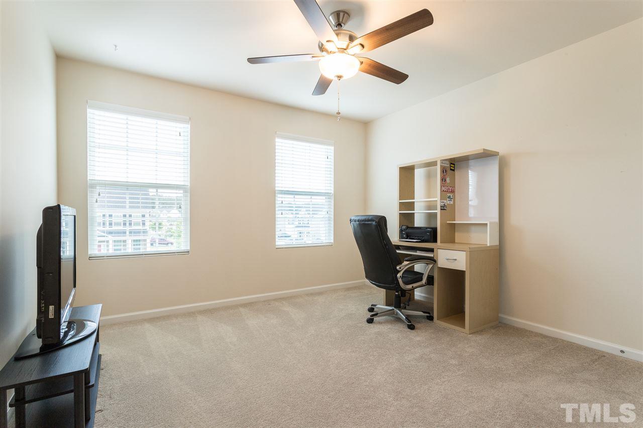 333 Hope Valley Road Knightdale, NC 27545 - Photo 16 of 22 a view of a workspace with furniture and a window