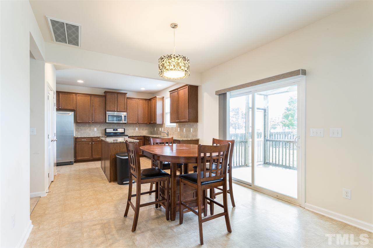 333 Hope Valley Road Knightdale, NC 27545 - Photo 7 of 22 a view of a dining room with furniture window and wooden floor
