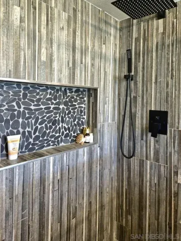 a bed sitting in a bedroom and table