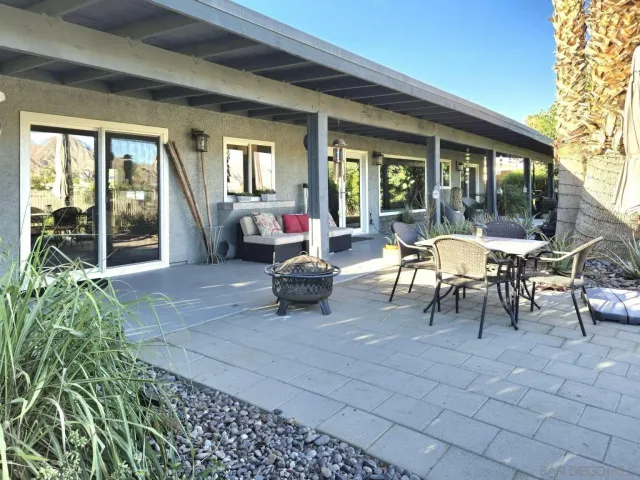 a view of a house with backyard porch and patio