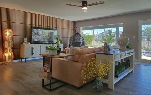 a living room with furniture and a large window
