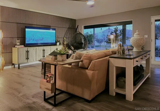 a view of a house with swimming pool and a yard