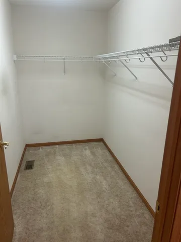 a view of an empty walk in closet