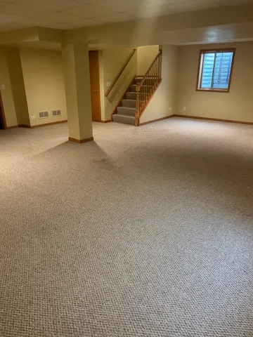 a view of an empty room with windows