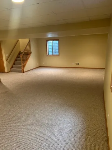 a view of a livingroom with a staircase