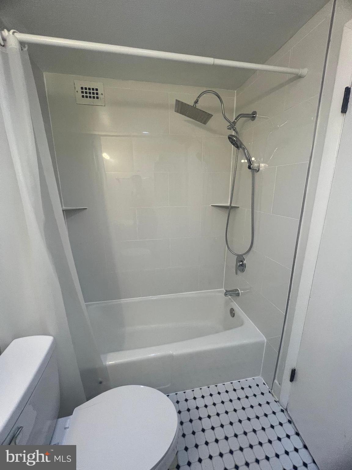 3245 Rio Drive, Unit 204 Falls Church, VA 22041 - Photo 11 of 34 a bathroom with a bathtub and a toilet