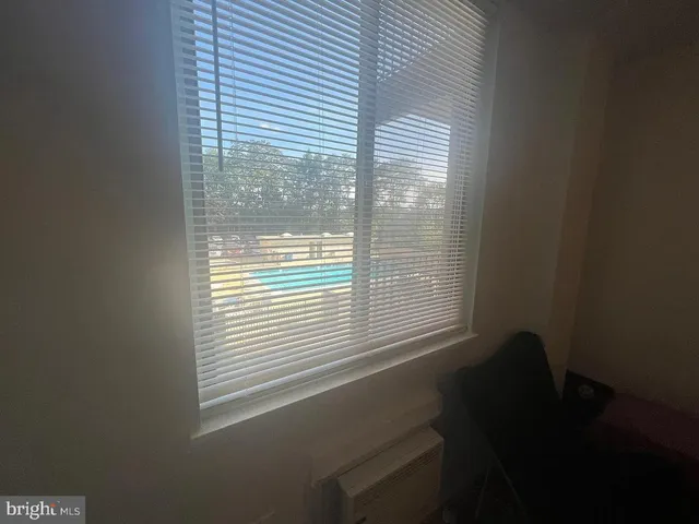 a view of a room that has a window in it