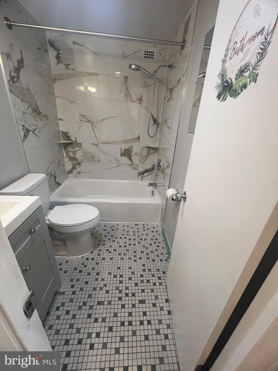 3245 Rio Drive, Unit 204 Falls Church, VA 22041 - Photo 15 of 34 a bathroom with a sink a toilet and shower