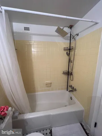 a bathroom with a sink toilet and mirror