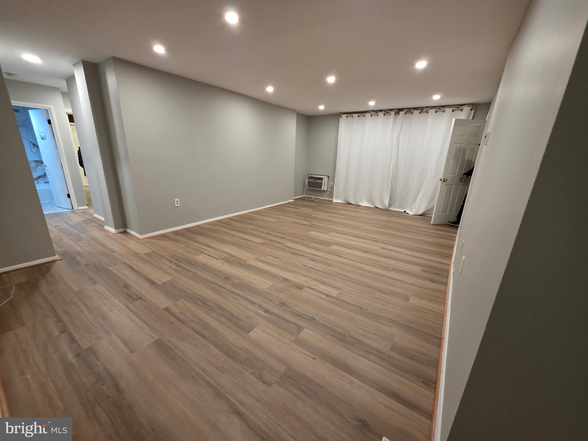 3245 Rio Drive, Unit 204 Falls Church, VA 22041 - Photo 2 of 34 a view of hallway with a wooden floor