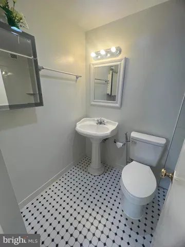 a bathroom with a bathtub and a toilet
