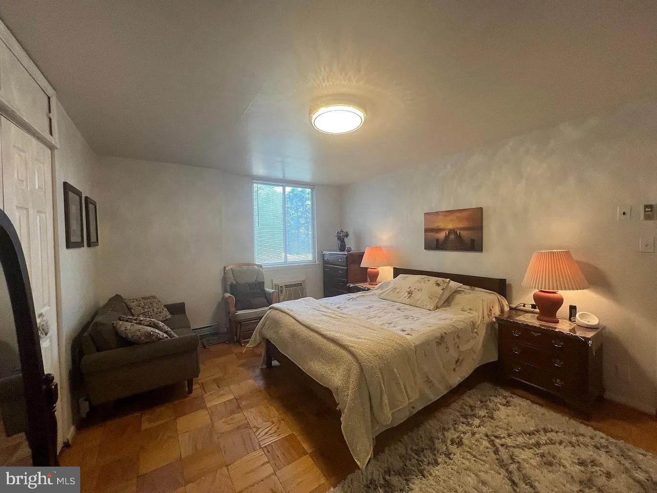 3245 Rio Drive, Unit 204 Falls Church, VA 22041 - Photo 26 of 34 a bedroom with a bed and wooden floor