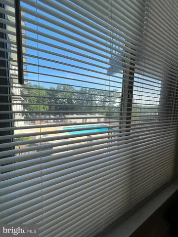 a bathroom with a shower and a sink