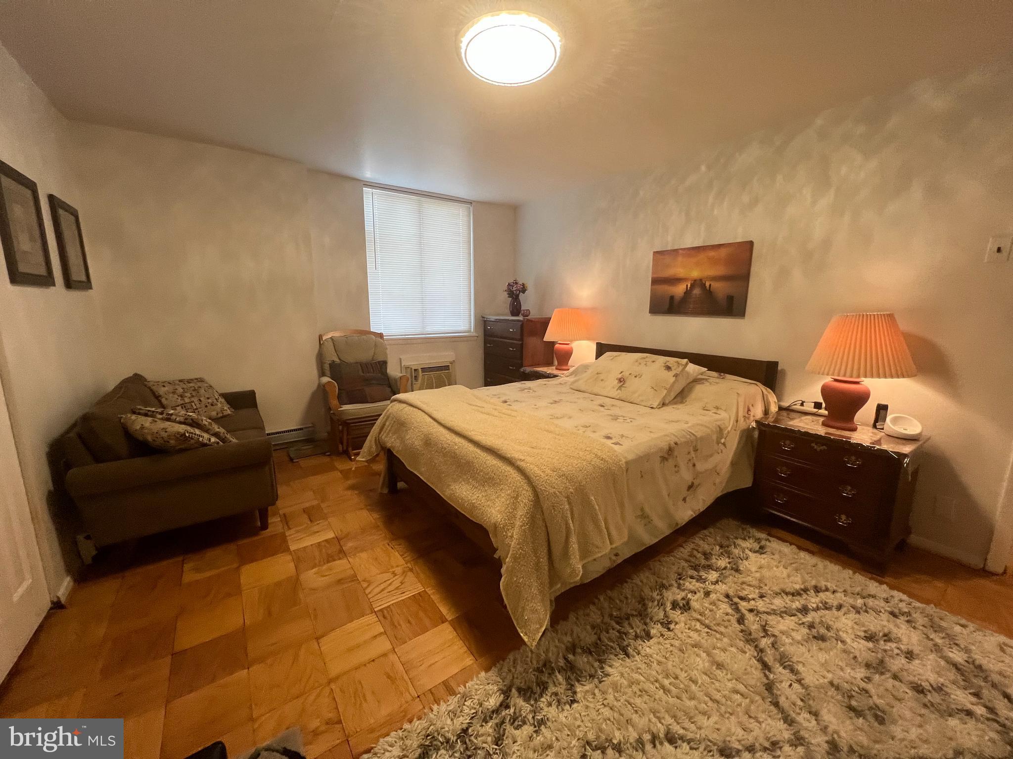 3245 Rio Drive, Unit 204 Falls Church, VA 22041 - Photo 27 of 34 a bedroom with a bed and a couch