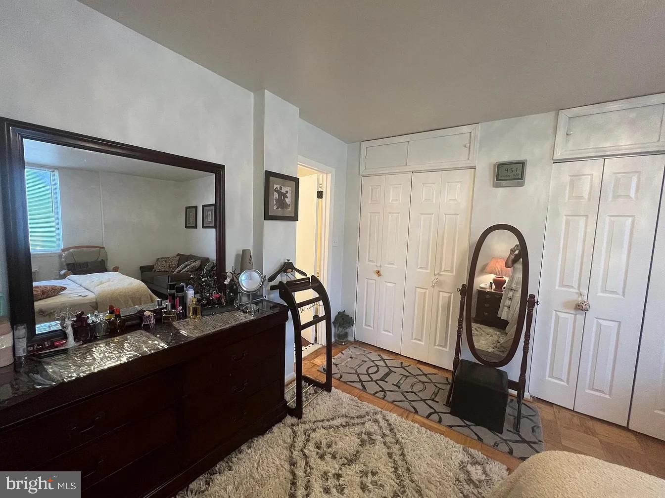 3245 Rio Drive, Unit 204 Falls Church, VA 22041 - Photo 31 of 34 a bed room with a bed and a mirror
