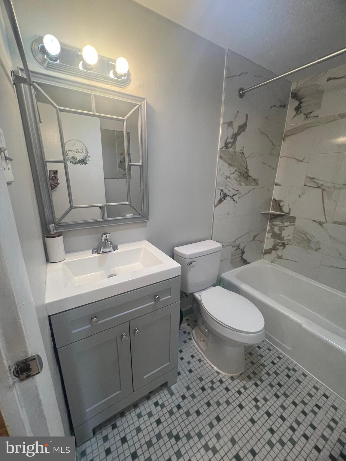 3245 Rio Drive, Unit 204 Falls Church, VA 22041 - Photo 5 of 34 a bathroom with a sink toilet and shower