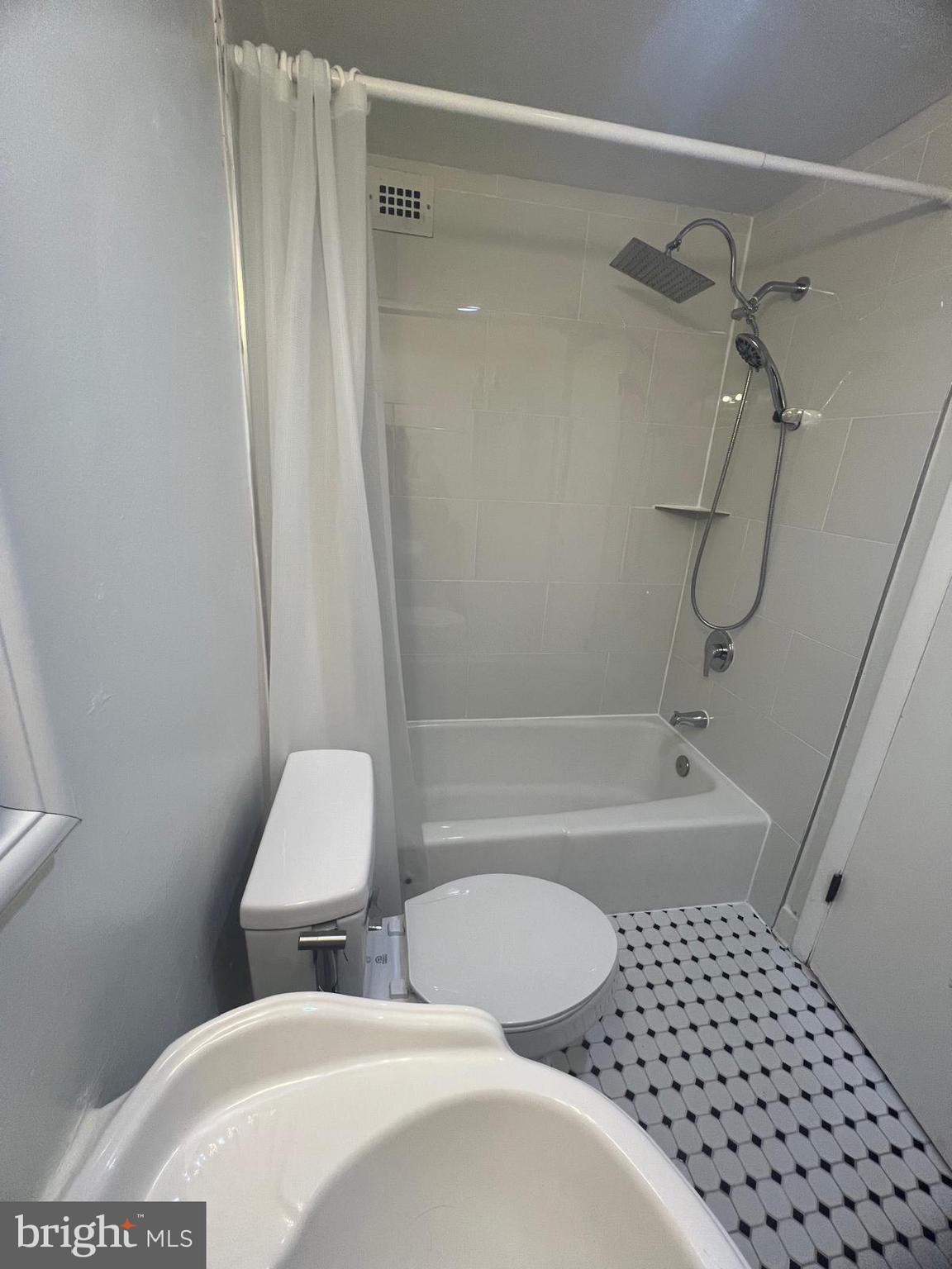 3245 Rio Drive, Unit 204 Falls Church, VA 22041 - Photo 10 of 34 a bathroom with a toilet and a shower