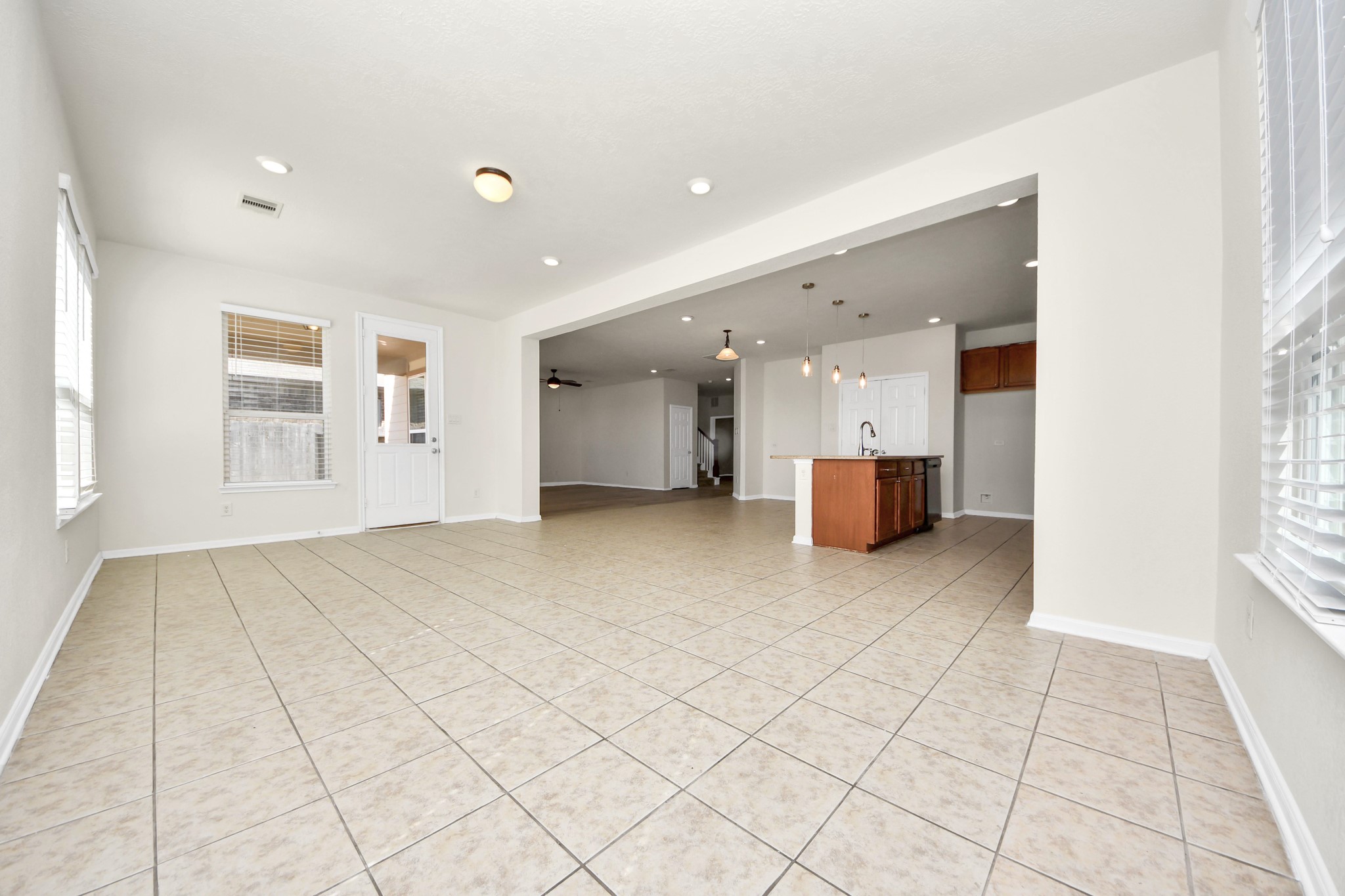 24123 Adobe Ridge Lane Katy, TX 77493 - Photo 19 of 45 a view of empty room with wooden floor and windows