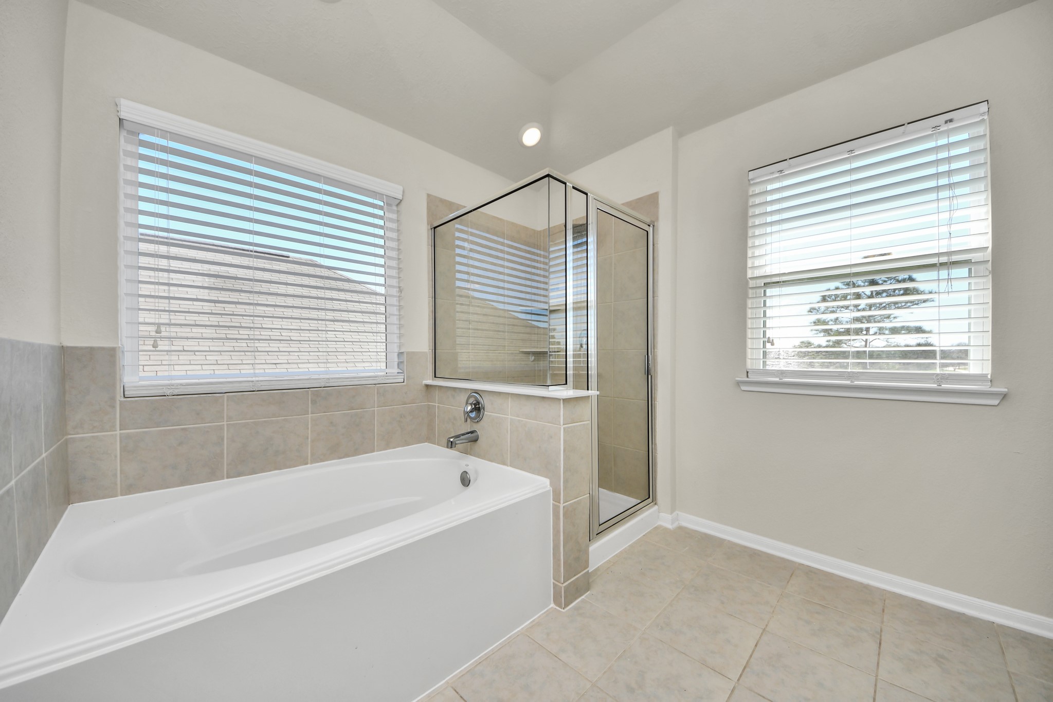 24123 Adobe Ridge Lane Katy, TX 77493 - Photo 37 of 45 a white bath tub sitting in a bathroom next to a window